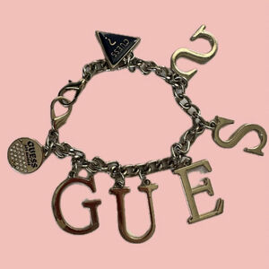 Guess Logo Charm Bracelet – Gold Tone Statement